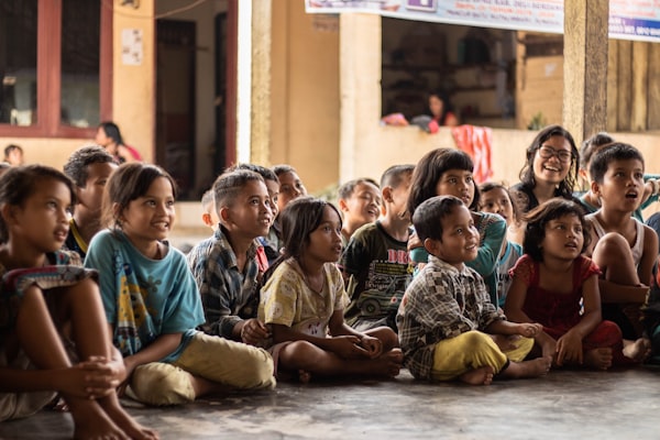 Volunteers helping children